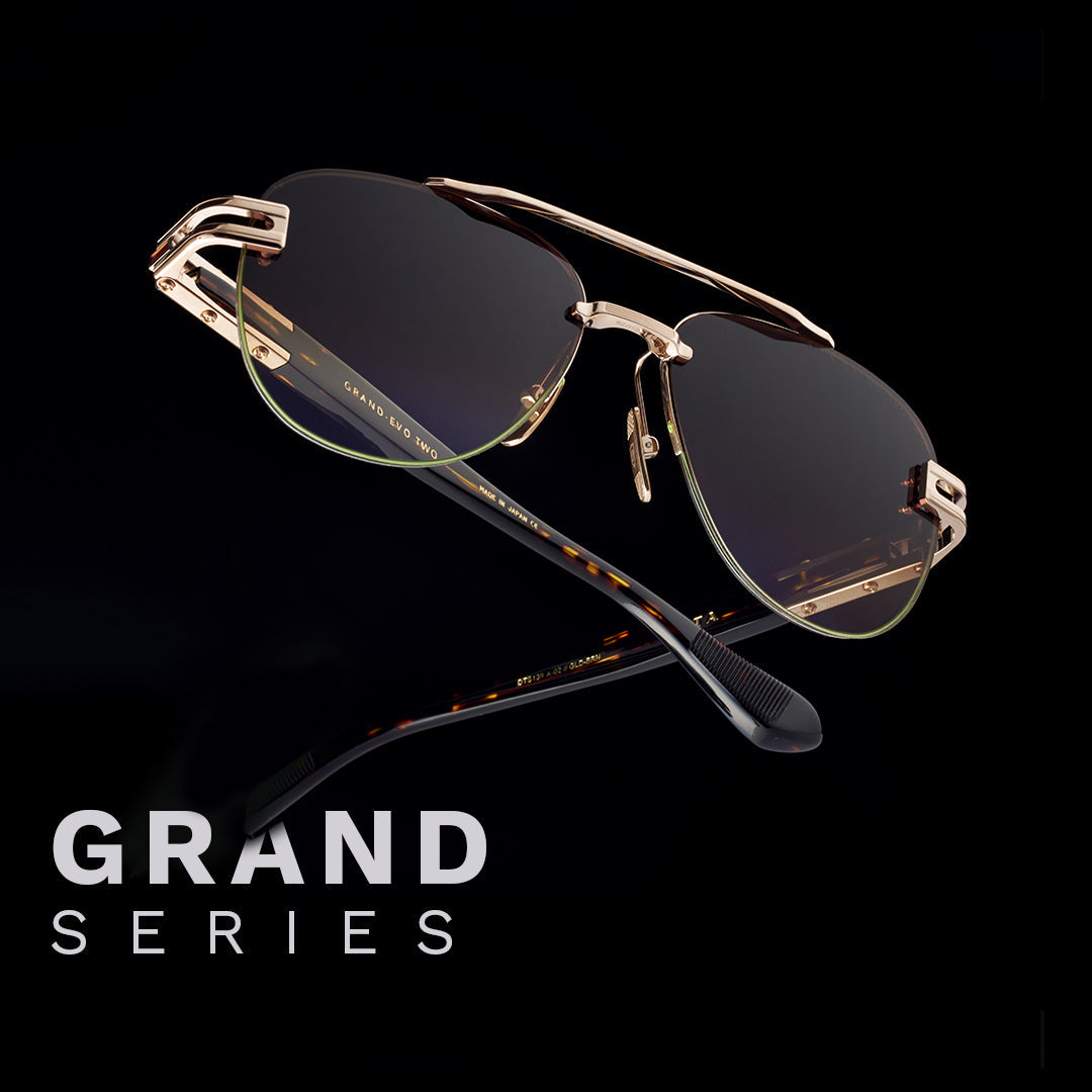 Luxury sunglasses with gold frames and dark lenses on a black background. Bold text reads “Grand Series,” conveying elegance and sophistication.