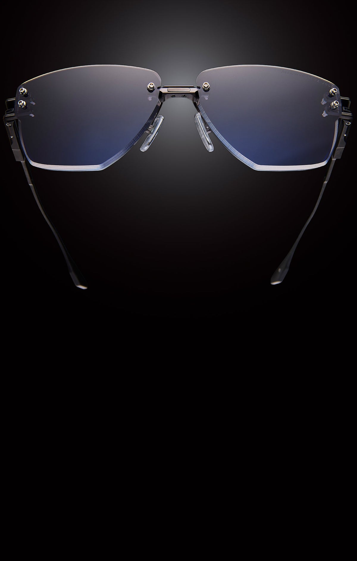Sunglasses with blue lenses on a black background